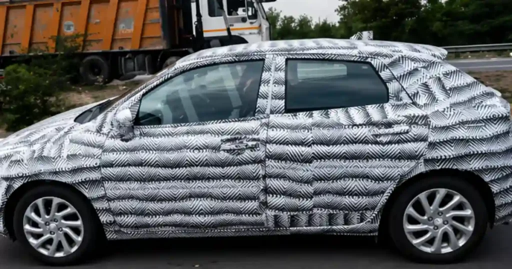 2026 Maruti Suzuki Baleno facelift spotted side profile with camouflage highlighting design changes