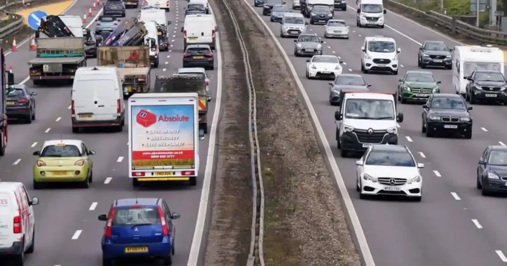 Busy highway traffic in India highlighting stricter traffic rules and AI-based enforcement under new car safety laws 2026