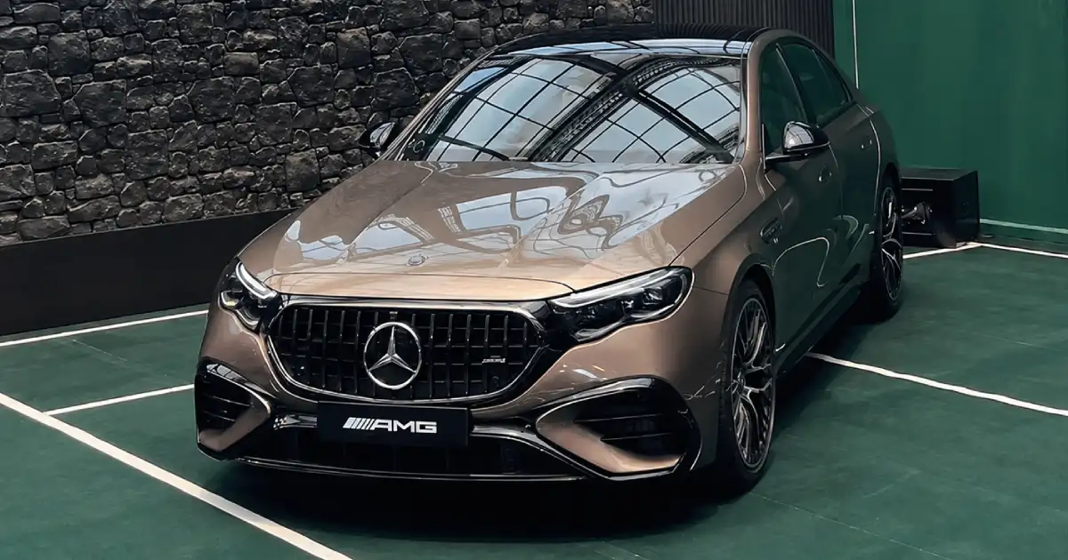 2026 Mercedes-AMG E 53 performance sedan showcasing the AMG Panamericana grille, sporty front design and plug-in hybrid luxury styling.